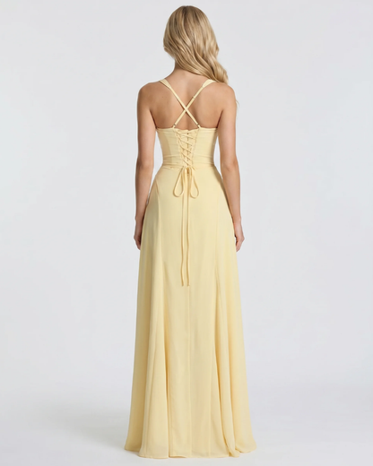 Women yellow corset maxi dress with mermaid silhouette and floor length hem, 45 degree angle