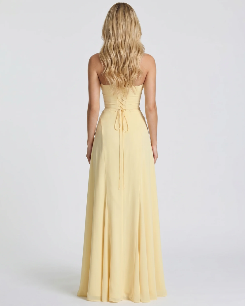 Women yellow corset maxi dress with fitted body and mermaid skirt, side profile