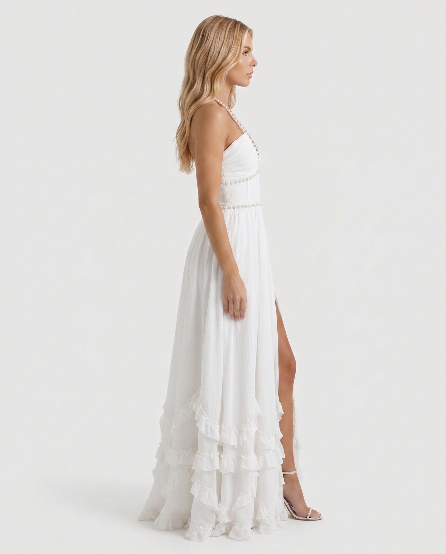 Women powder bloom halter maxi dress with deep V neckline and tiered ruffle skirt, side profile