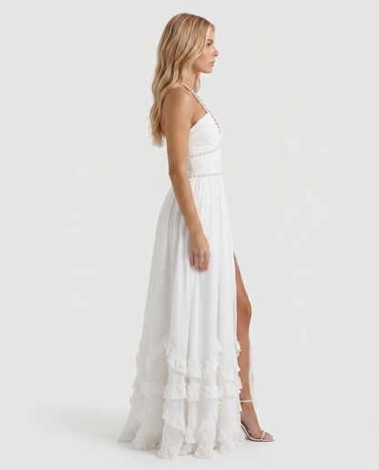 Women powder bloom halter maxi dress with deep V neckline and tiered ruffle skirt, side profile