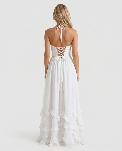 Women powder bloom halter maxi dress with pearl strap back and tiered ruffles, back view