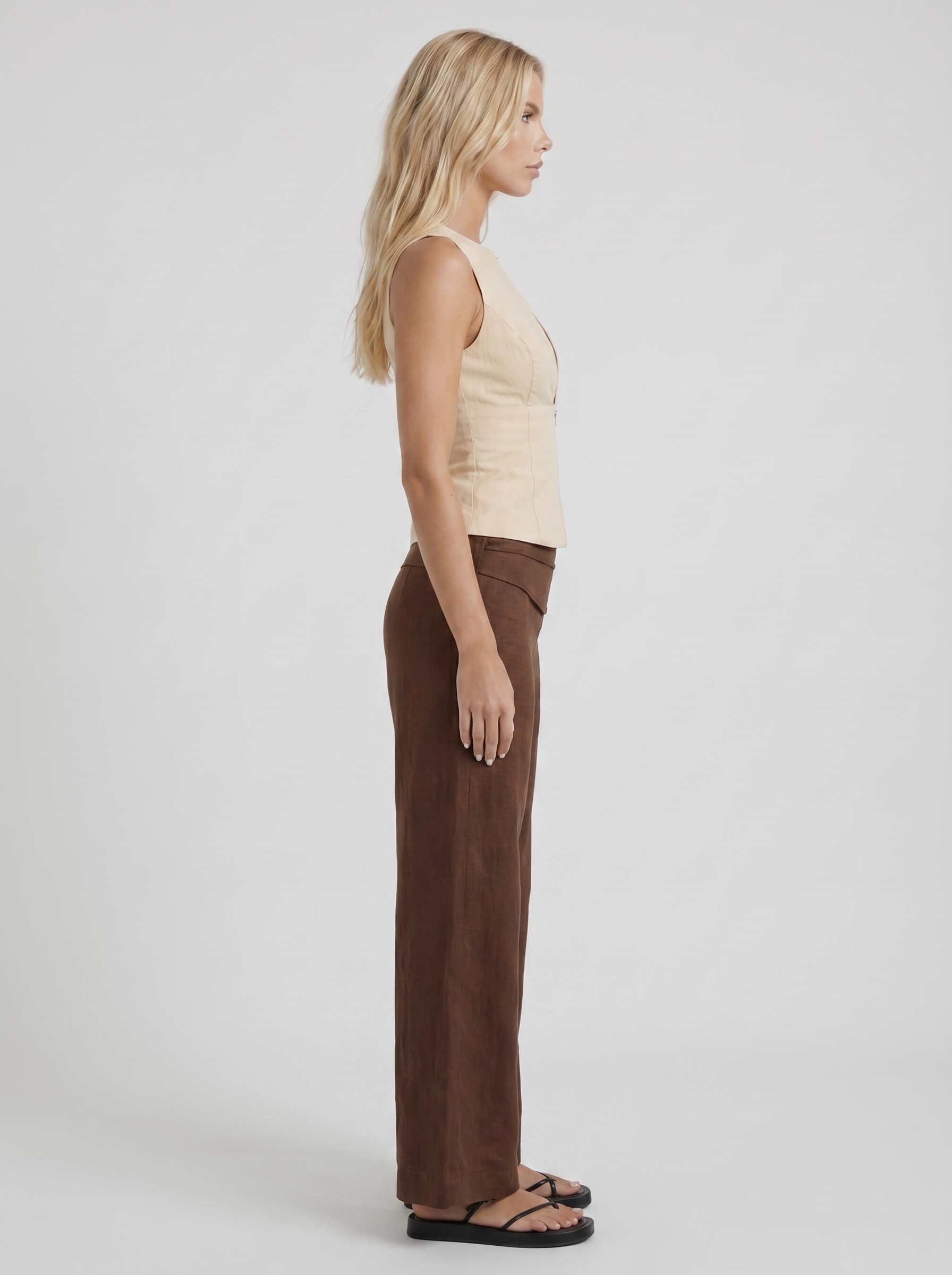 Women brown high waist tie waist wide leg linen pants, side profile view