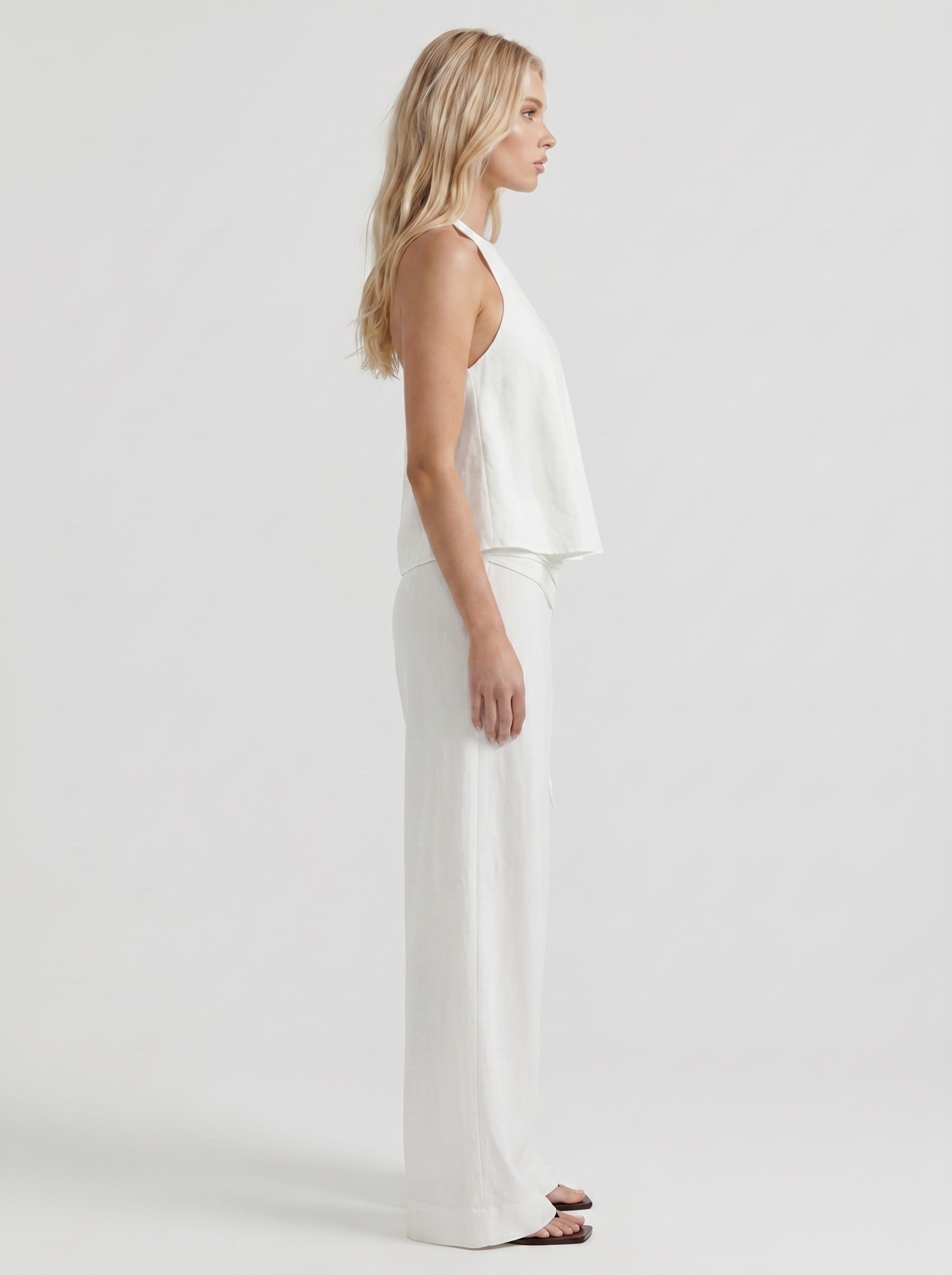Women white high waist tie waist wide leg linen pants, side profile view