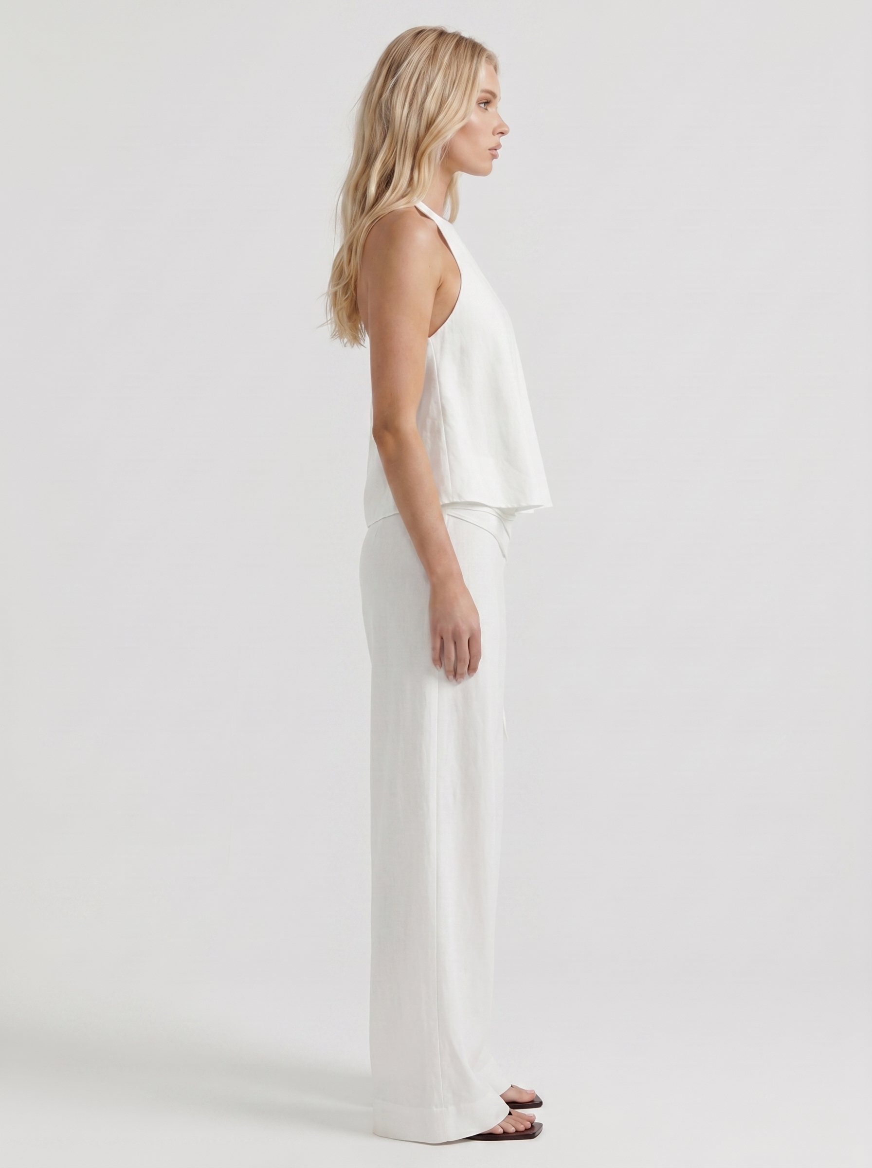 Women white high waist tie waist wide leg linen pants, side profile view