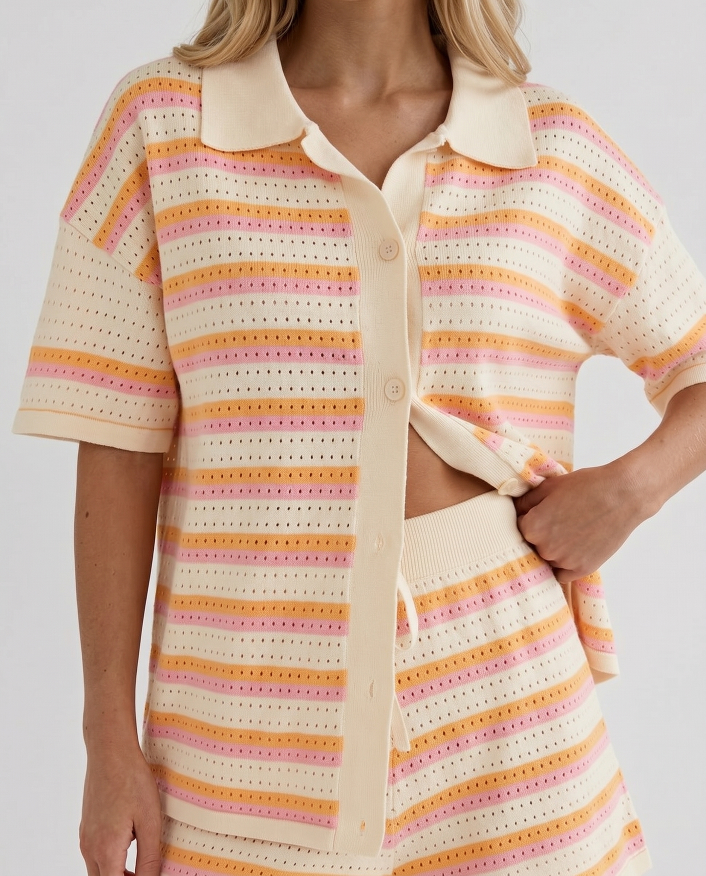 Women cream striped shorts set closeup of polo collar, button placket, and stripe pattern