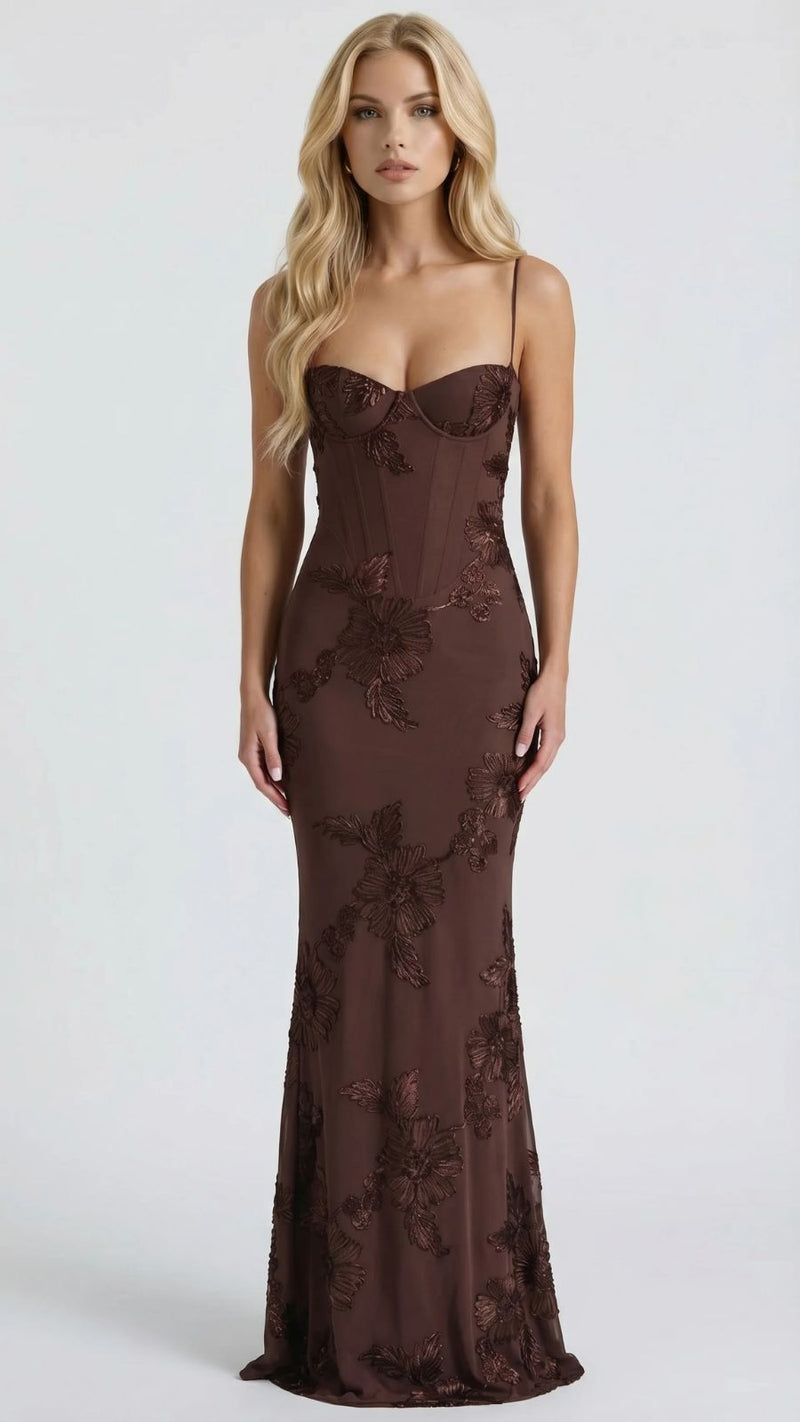 Full view of a brown floral maxi dress with a fitted bodice, thin straps, and embroidered details.