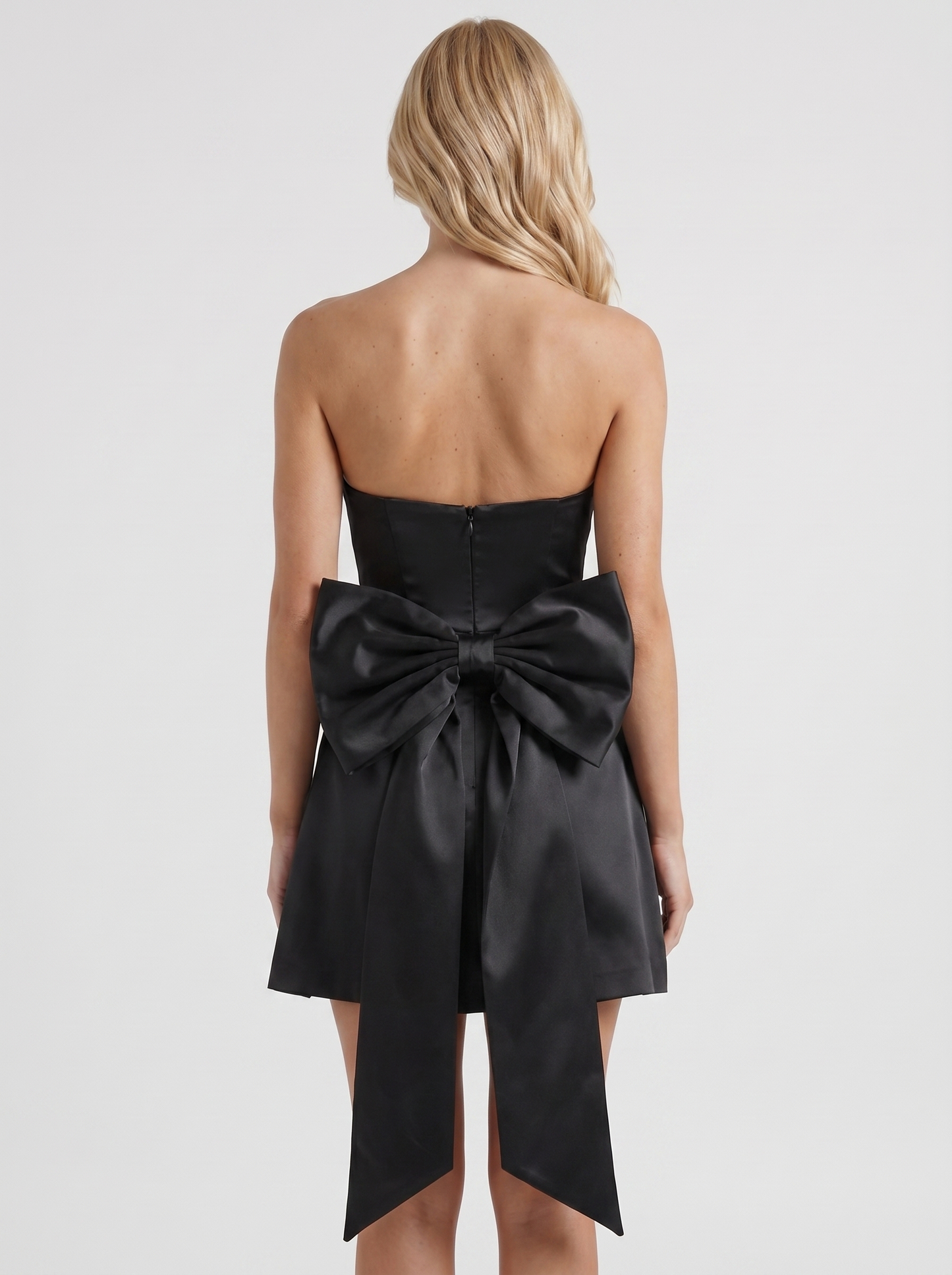 Women black strapless side bow satin mini dress, back view