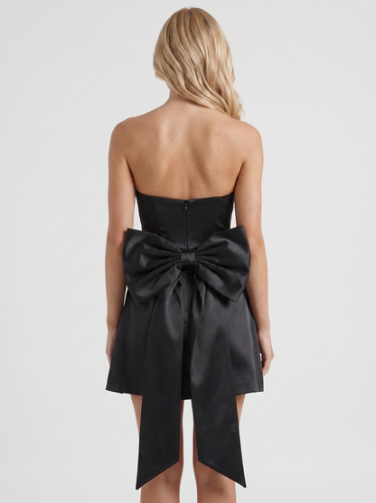 Women black strapless side bow satin mini dress, back view