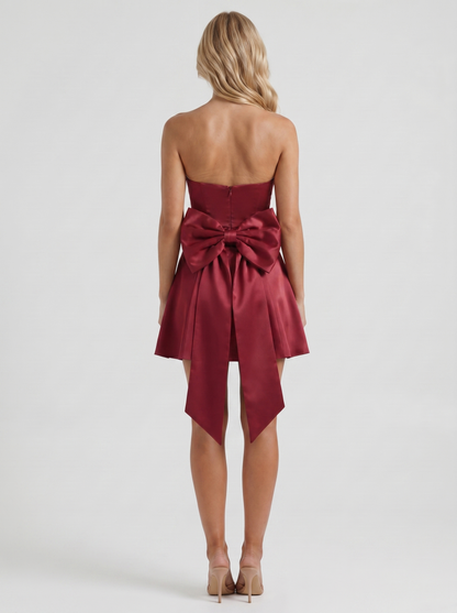 Women burgundy strapless side bow satin mini dress, back view