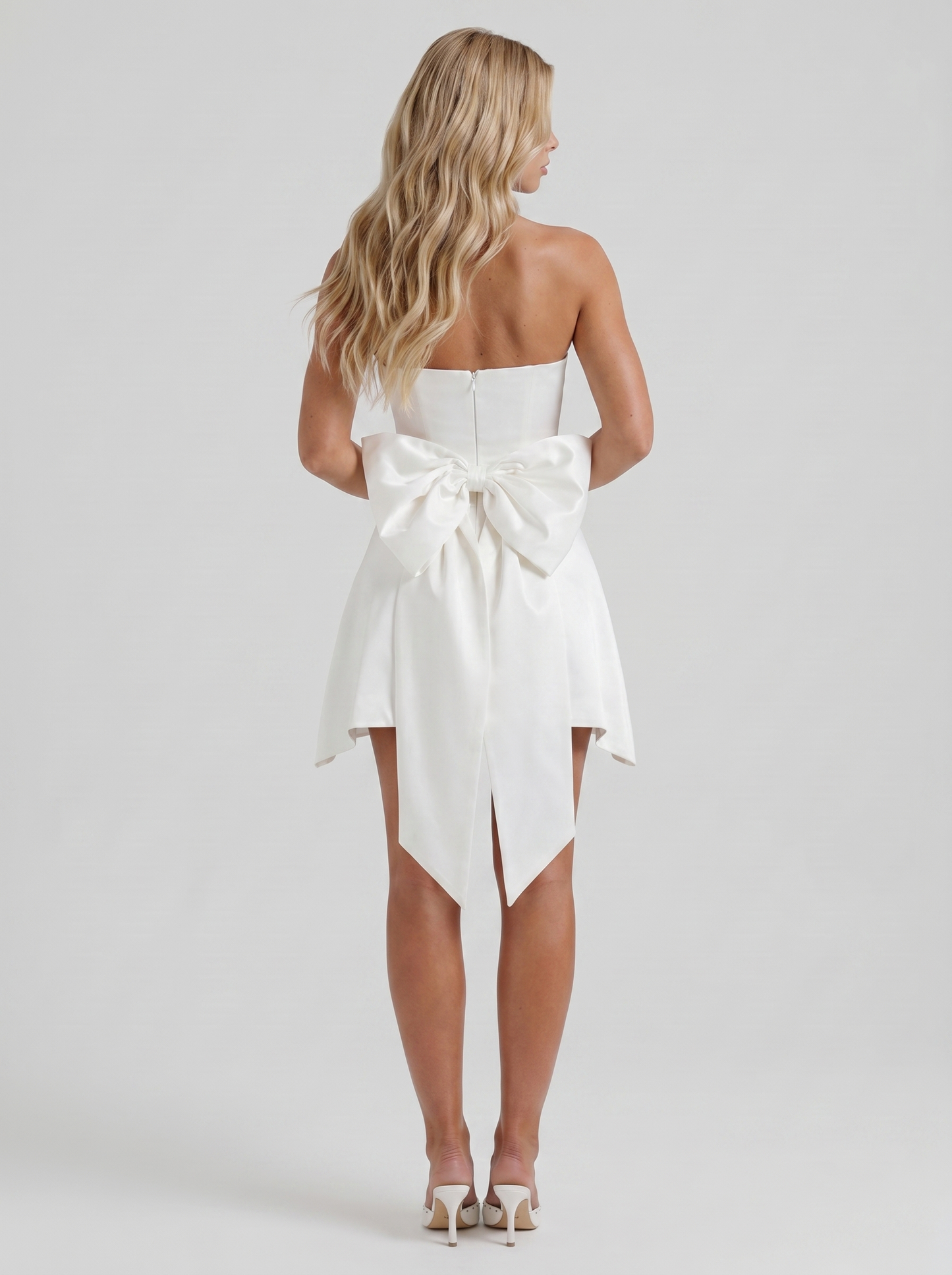 Women ivory strapless side bow satin mini dress, back view