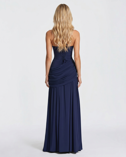 Women navy ruched maxi dress with fitted back bodice and flowing maxi skirt, back view
