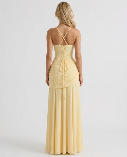 Women yellow ruched maxi dress with fitted back bodice and flowing maxi skirt, back view
