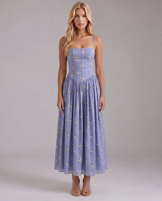 Lavender blue daisy print midi dress with spaghetti straps and fitted bodice, front view
