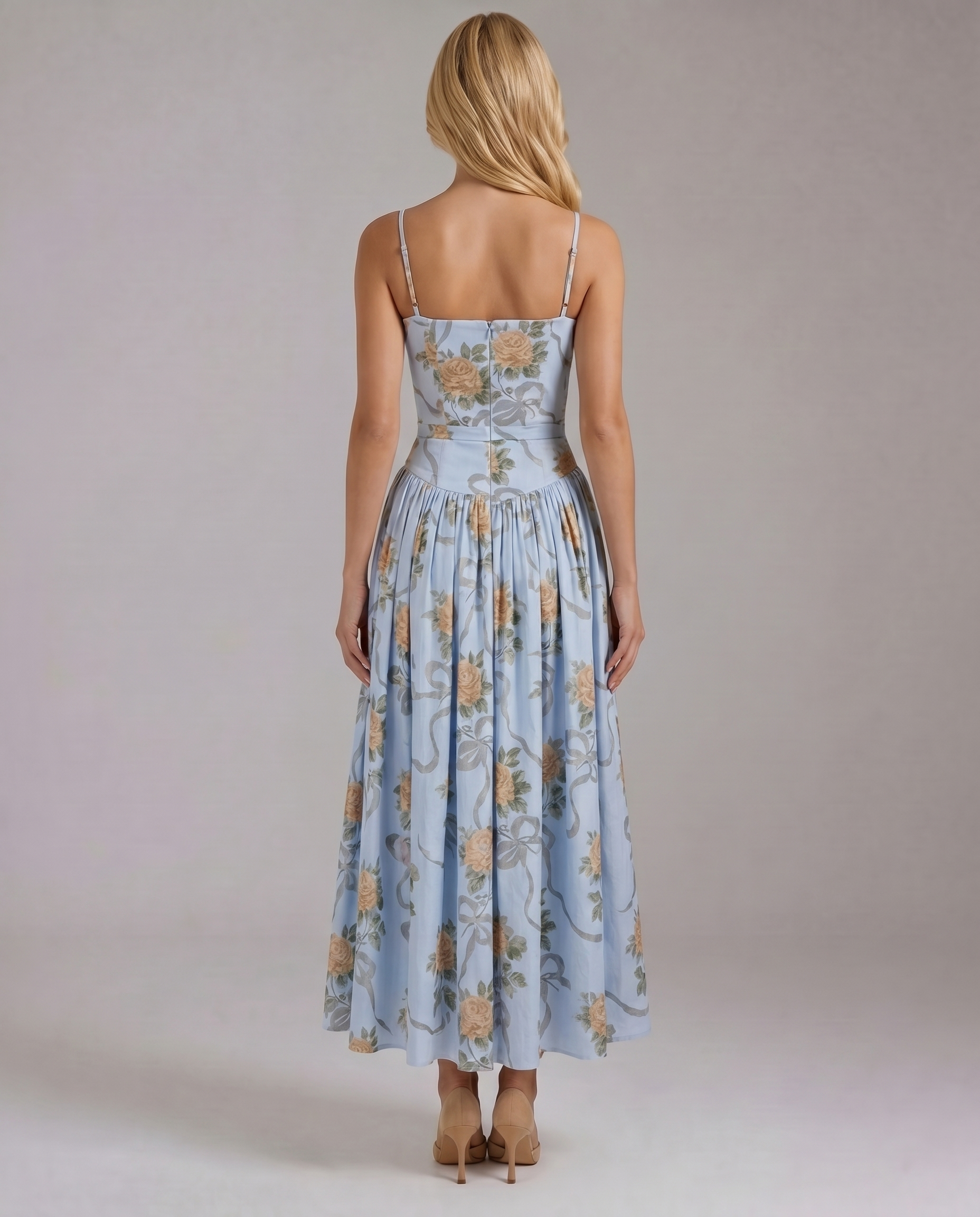 Back view vintage blue floral midi dress with straight back neckline, thin straps, and gathered skirt
