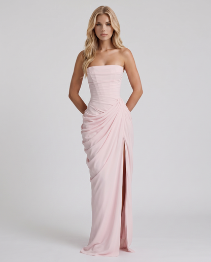 Women's blush pink ruched maxi dress with strapless bandeau neckline and high front slit