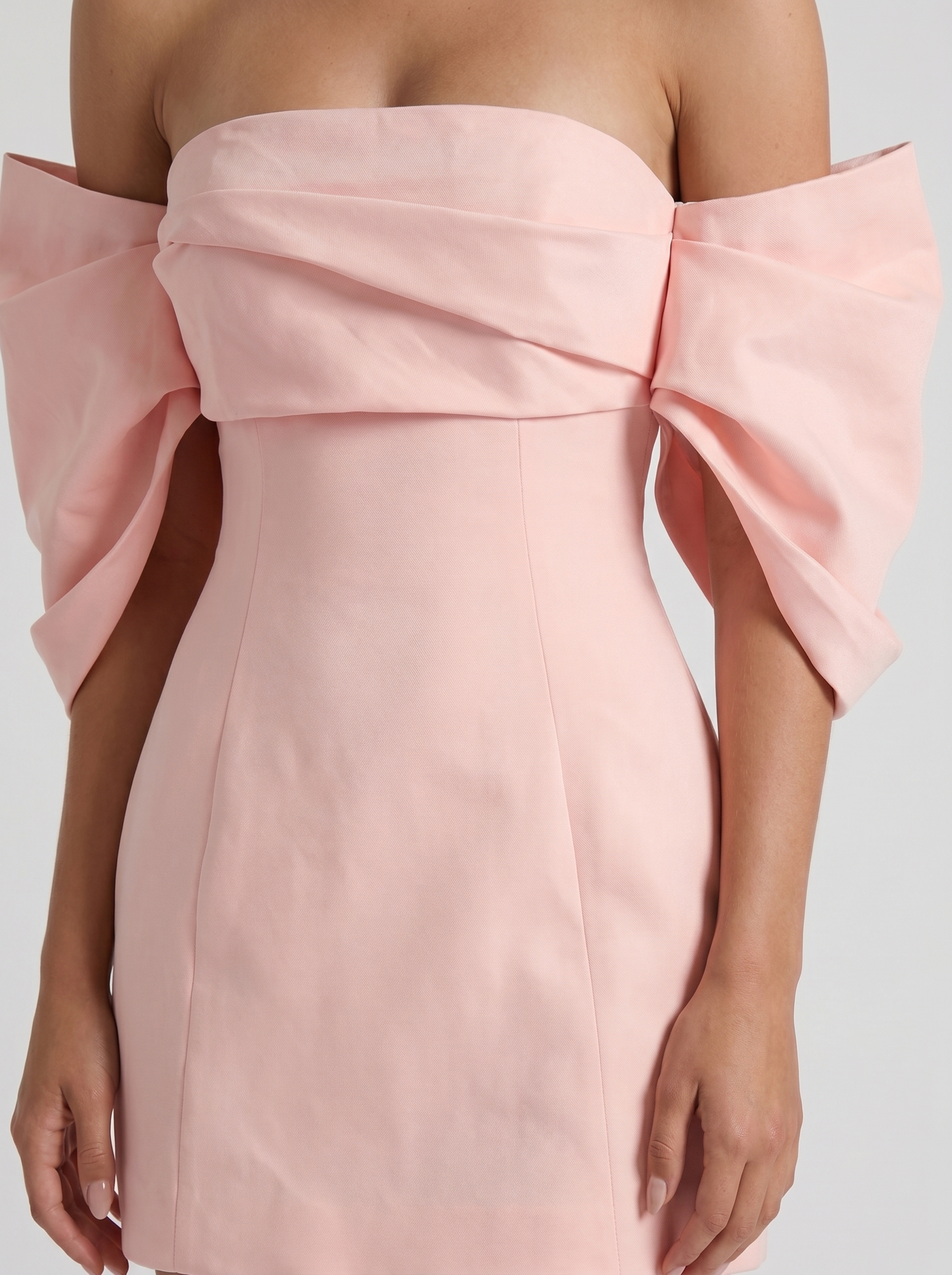Women blush off shoulder mini dress closeup of fold over neckline drape