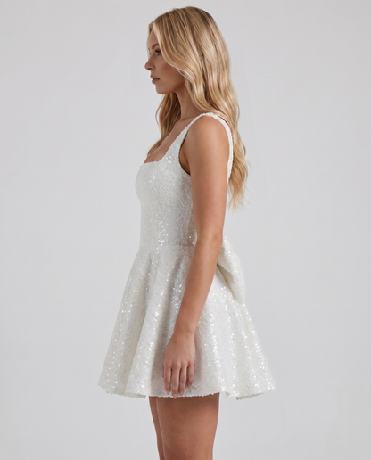 Women ivory square neck bow back mini dress with fit and flare silhouette, side view