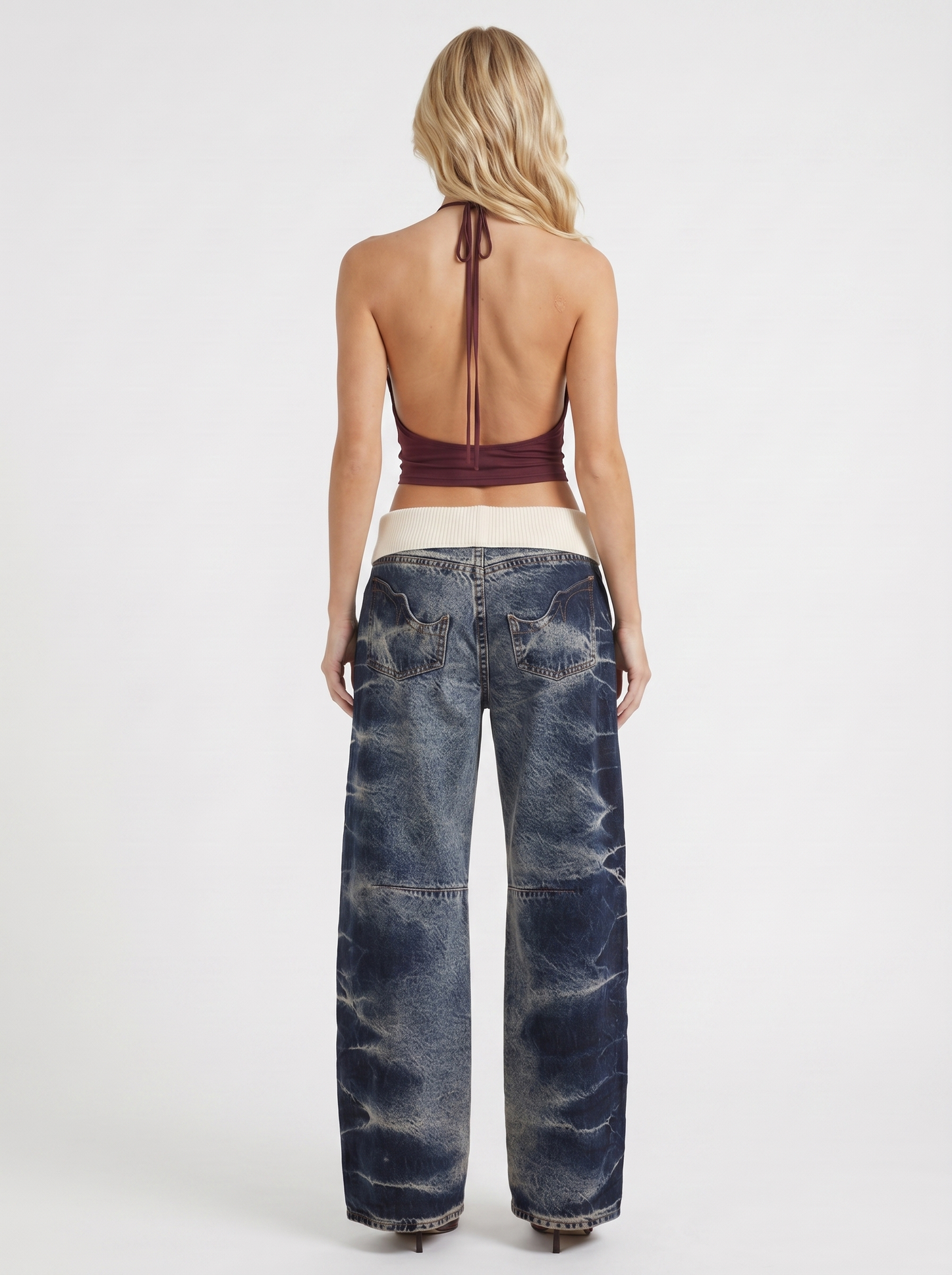 Women dark blue baggy wide leg distressed denim jeans, back view