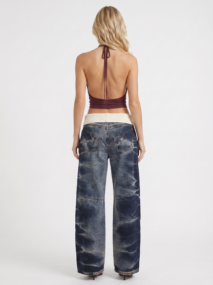 Women dark blue baggy wide leg distressed denim jeans, back view