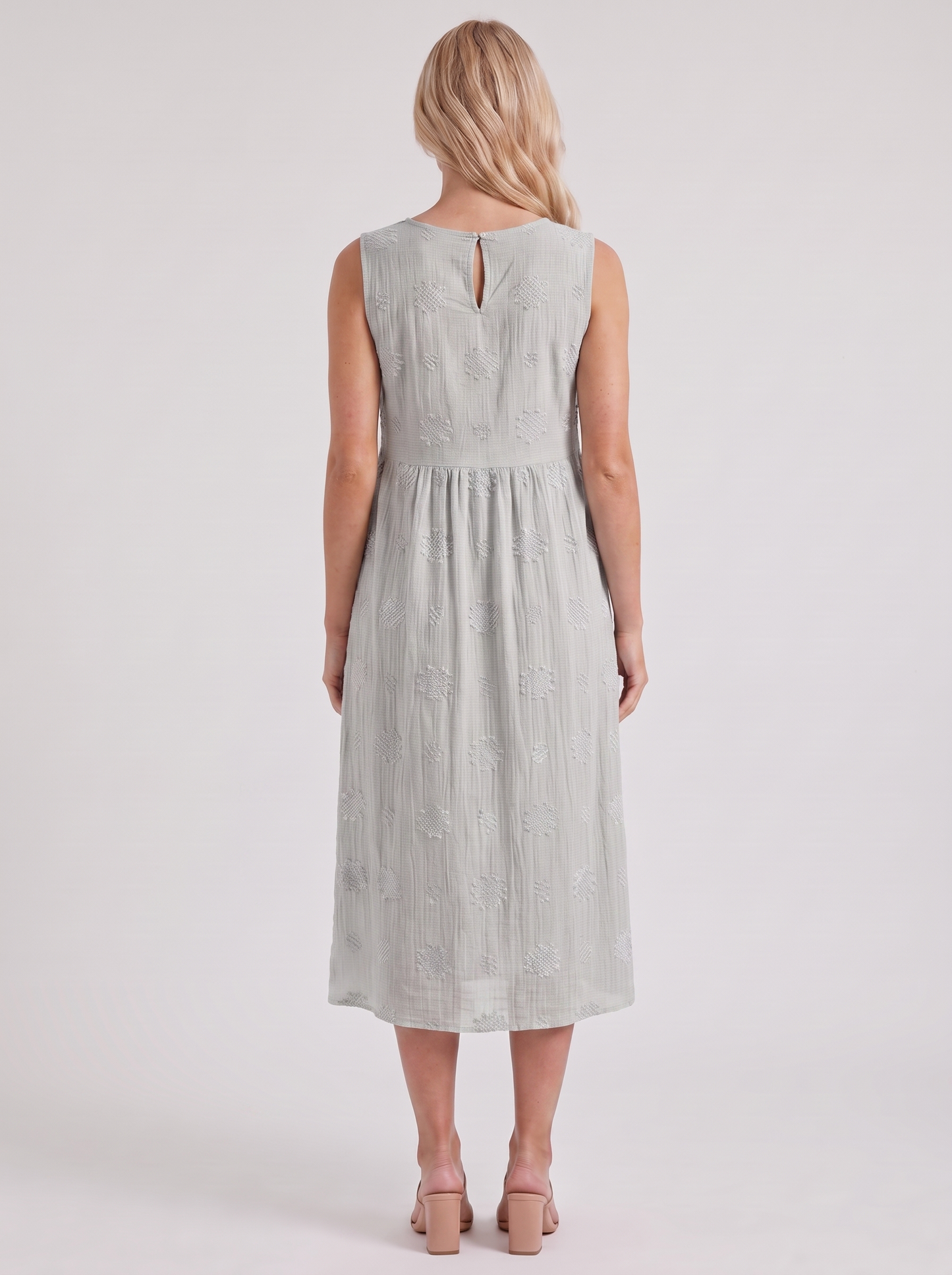 Women white embroidered midi dress with round neckline and embroidered detail