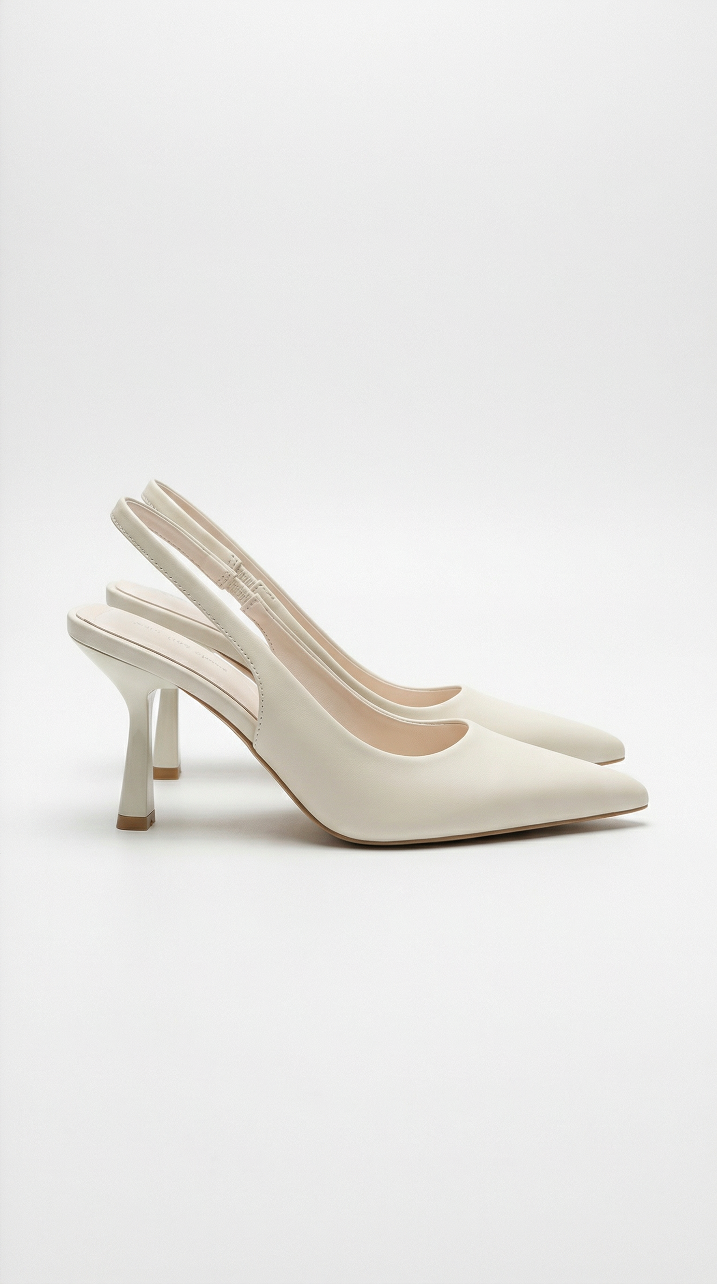 Women cream heeled sandals with pointed toe and slingback strap
