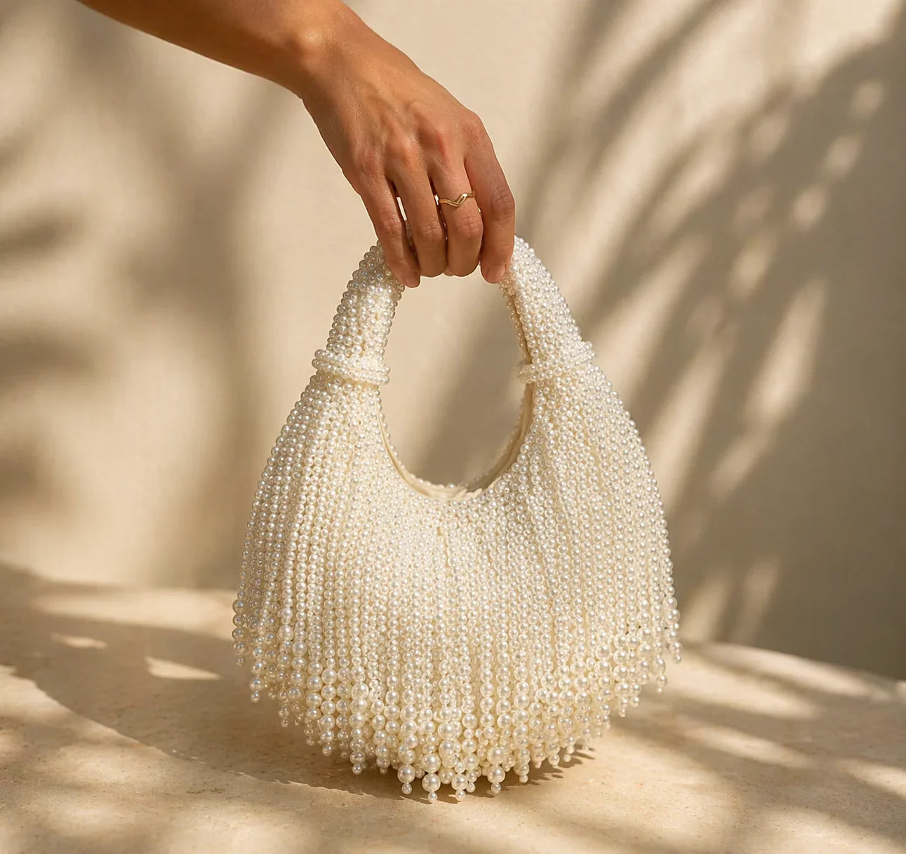 Women white shoulder bag with pearl beading and beaded detail