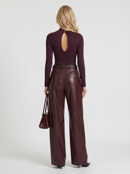 Women plum belted wide leg faux leather pants, back view