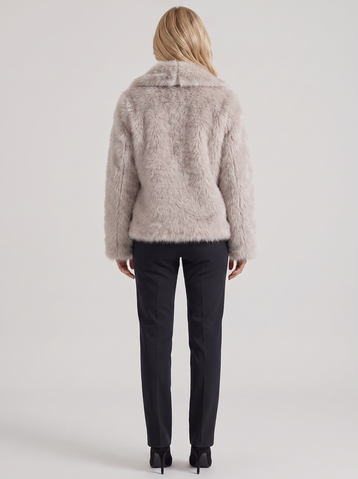 Women's beige fur coat with plush fur texture and hip length hem
