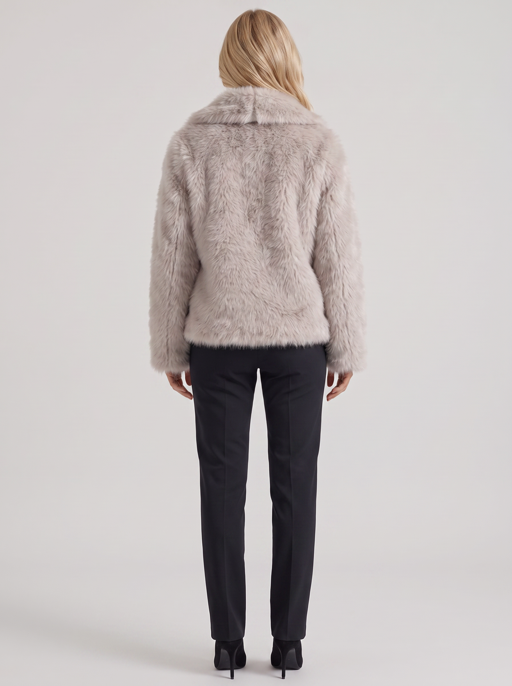 Women's beige fur coat with plush fur texture and hip length hem