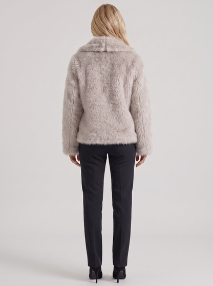 Women's beige fur coat with plush fur texture and hip length hem