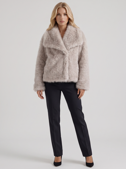 Women's beige fur coat with plush fur texture and hip length hem