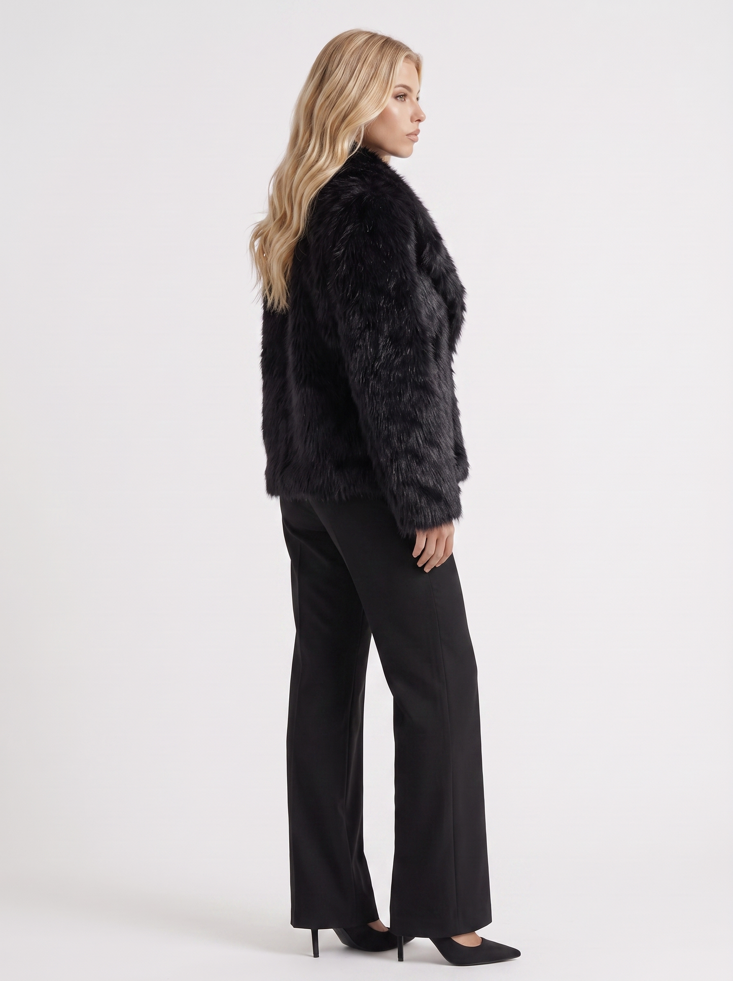 Women's black fur coat with plush fur texture and hip length hem
