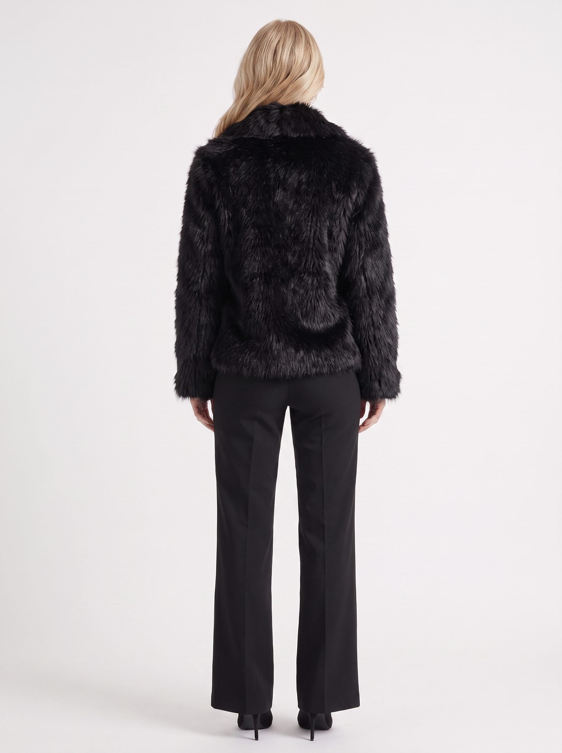 Women's black fur coat with plush fur texture and hip length hem