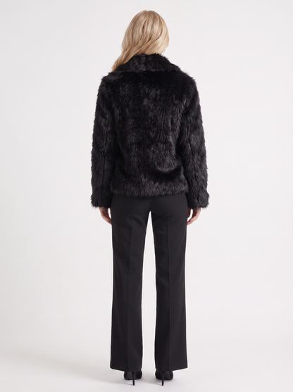 Women's black fur coat with plush fur texture and hip length hem