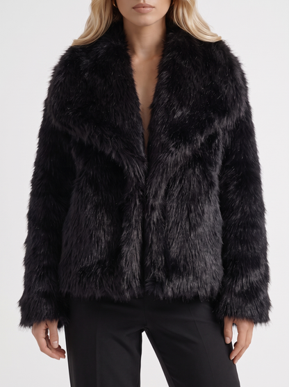 Women's black fur coat with plush fur texture and hip length hem