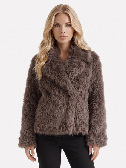 Women's brown fur coat with plush fur texture and hip length hem
