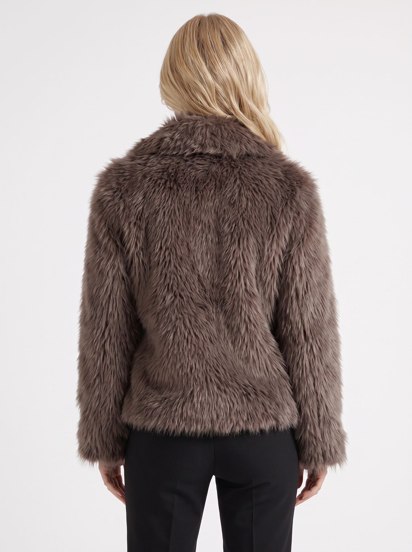 Women's brown fur coat with plush fur texture and hip length hem