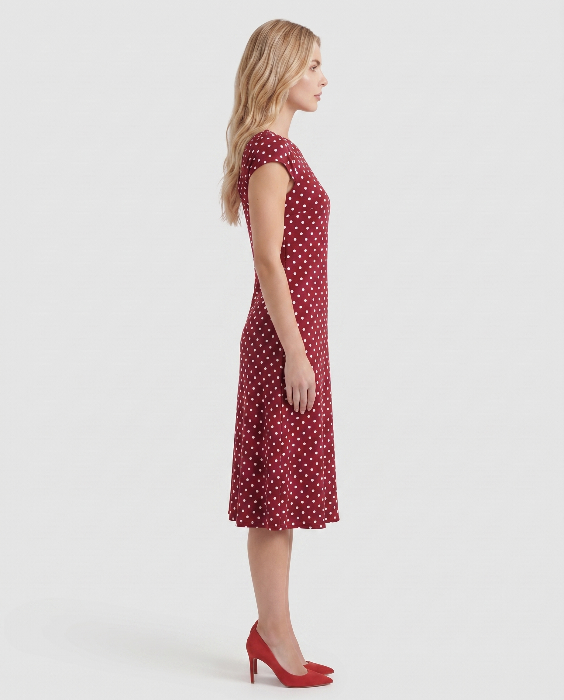 Women burgundy polka dot midi dress with cap sleeves and fit and flare midi, side profile
