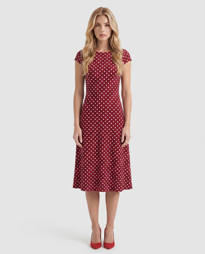 Women burgundy polka dot midi dress with crew neckline and fit and flare skirt, front view