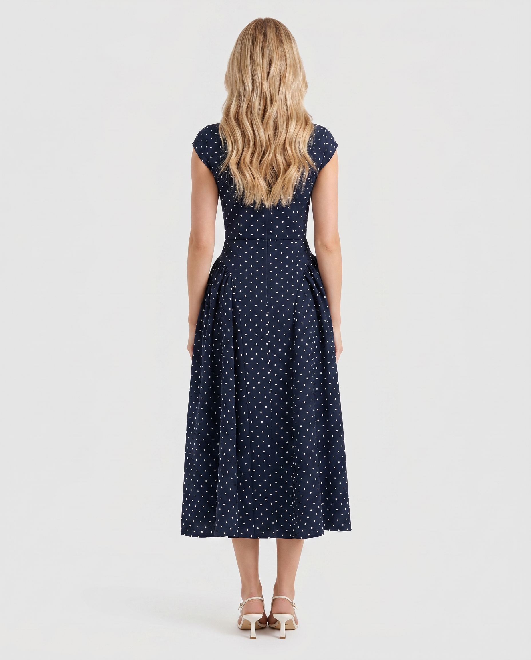 Women navy polka dot midi dress with crew back and fit and flare skirt, back view
