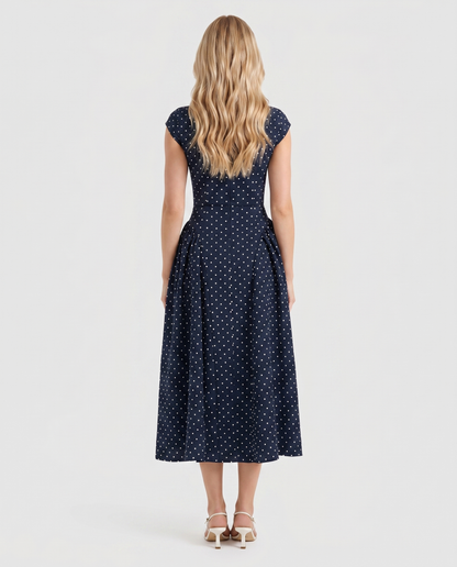 Women navy polka dot midi dress with crew back and fit and flare skirt, back view