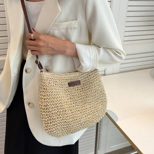 Women beige shoulder bag with adjustable strap and woven body