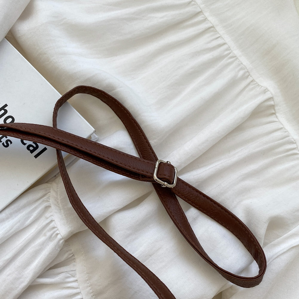 Women brown shoulder bag with adjustable strap and woven body
