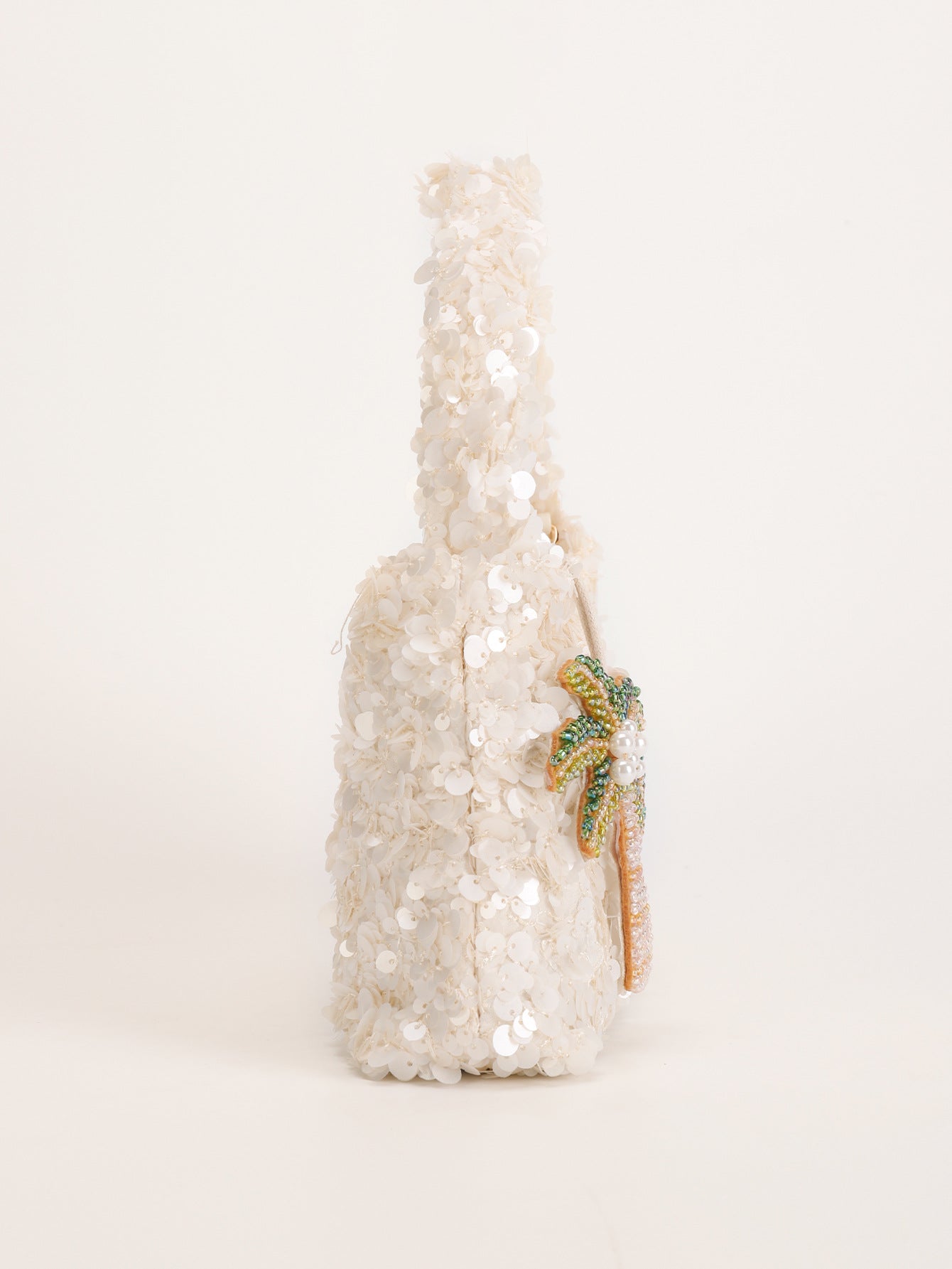 Women white shoulder bag with palm charm and sequin finish