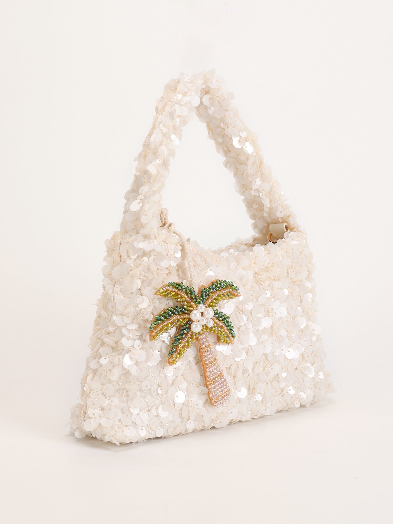 Women white shoulder bag with palm charm and sequin finish