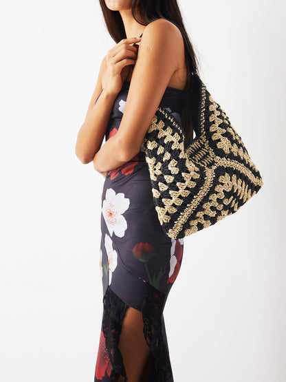 Women black shoulder bag with crochet knit and embroidered detail
