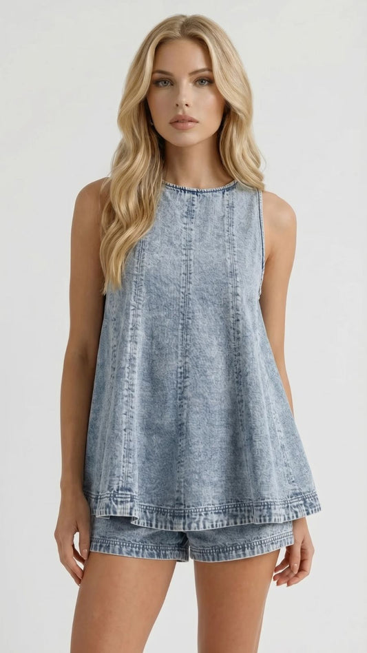 Close-up of a light wash acid denim sleeveless top with vertical seams and matching shorts set.