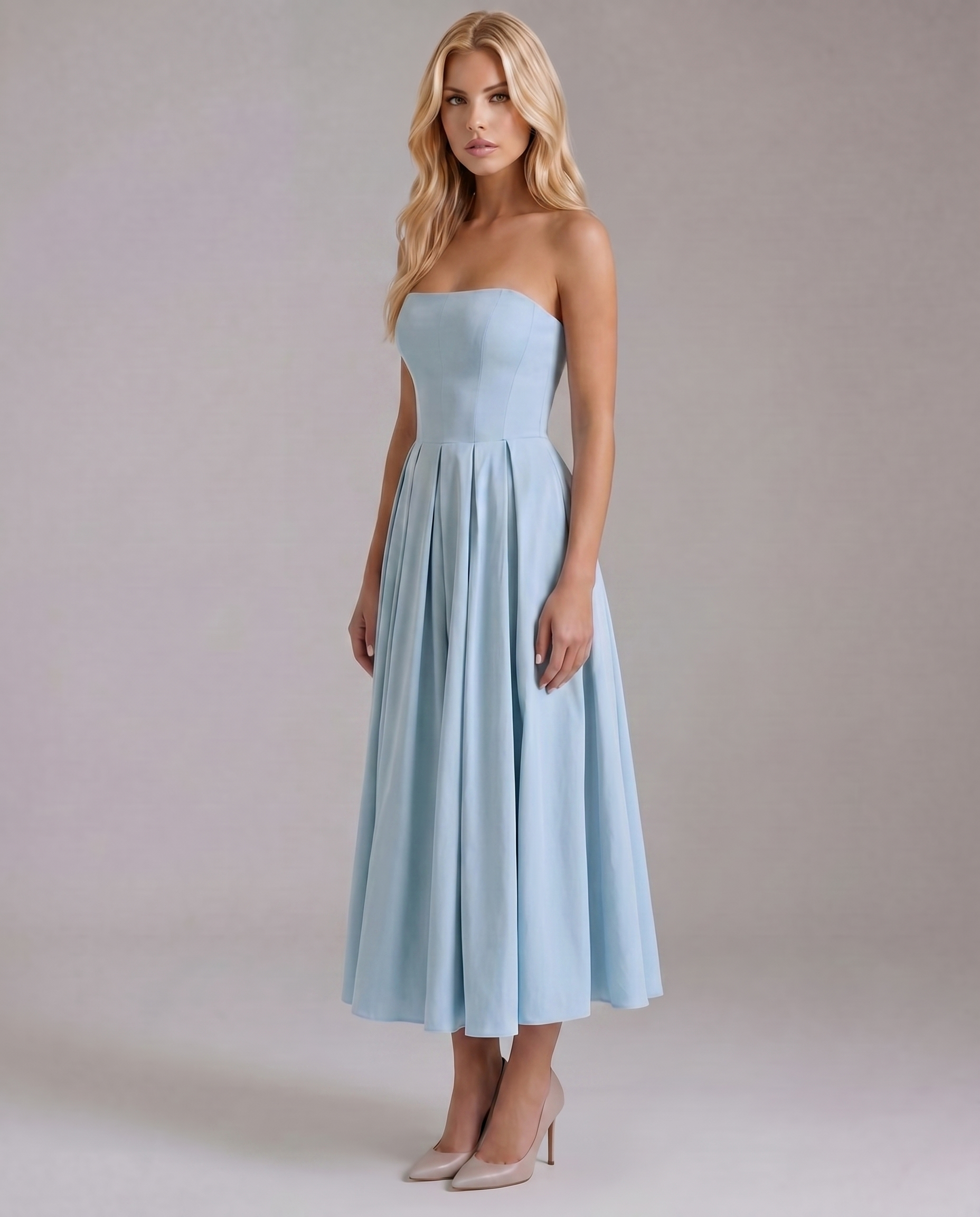 Three-quarter view of the light blue strapless midi dress, highlighting the elegant A-line silhouette