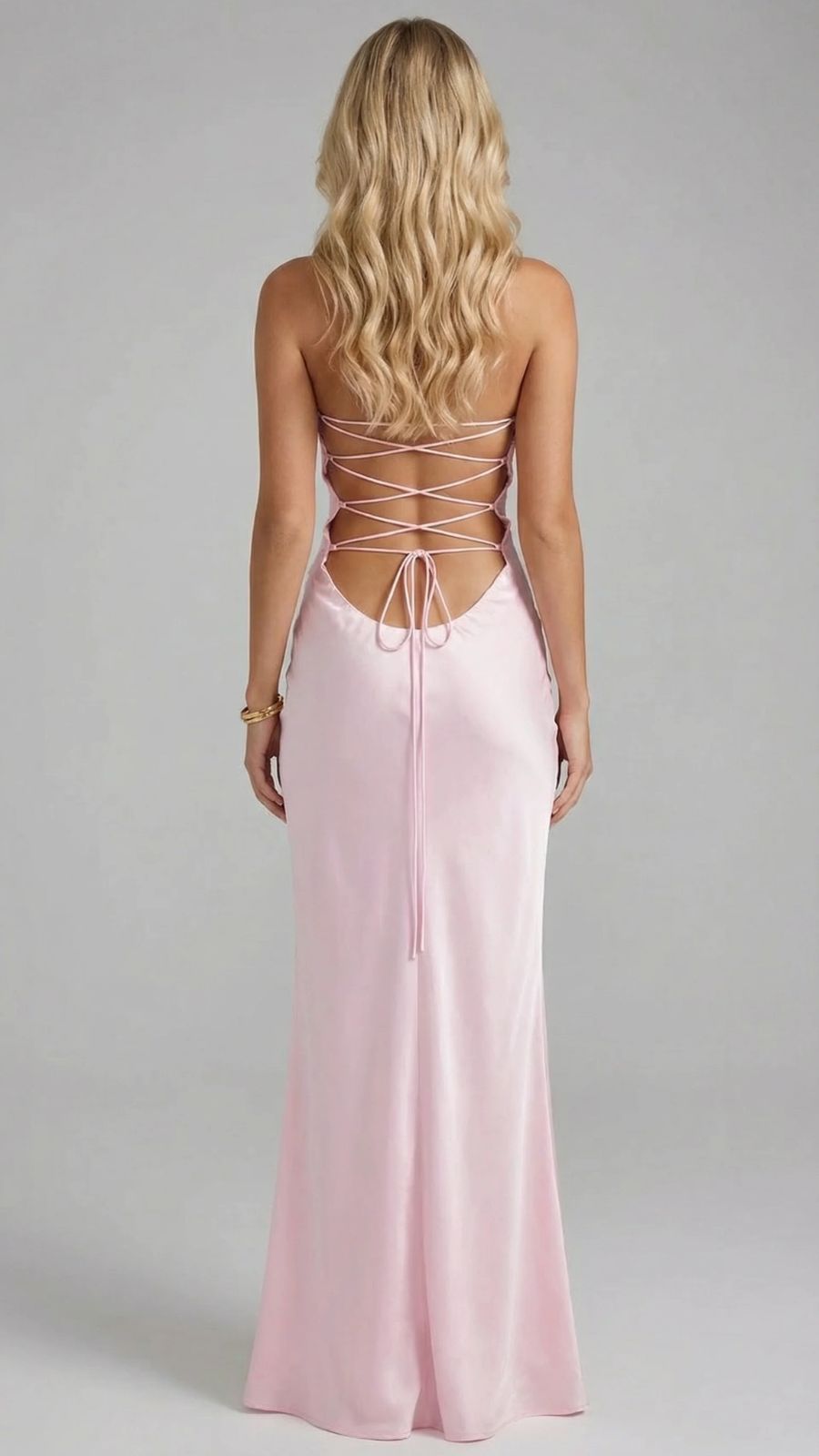 Women's pink sequin maxi dress, full back view, with lace-up detail and floor-length hem