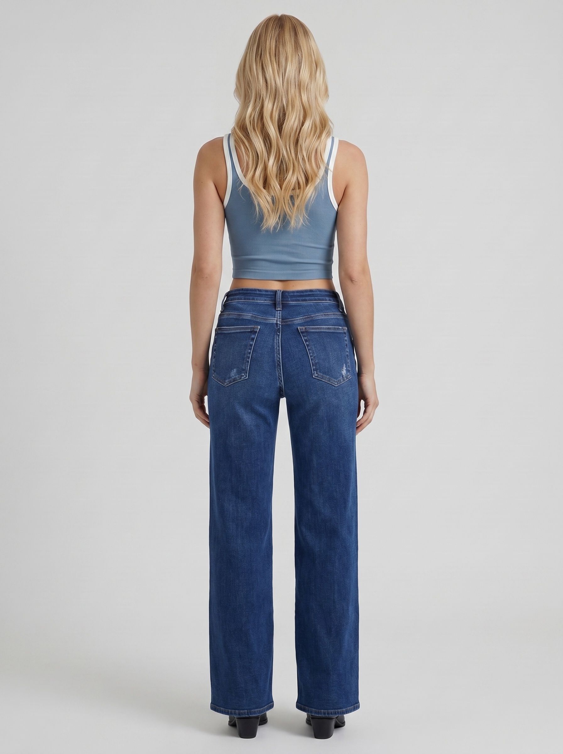 Women dark blue high rise wide leg jeans, back view
